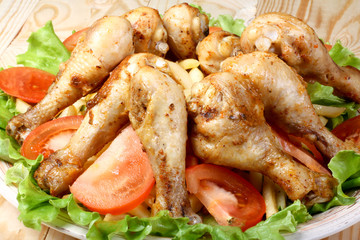 fried chicken legs, potato and vegetables