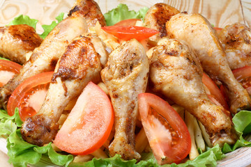 fried chicken legs, potato and vegetables