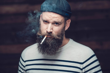 Close up Attractive Male Smoker with Long Beard