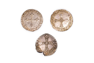 Vintage silver coins on a white background