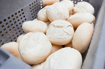 Fototapeta na wymiar Box of fresh baked bread rolls
