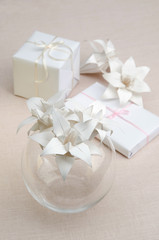 Origami white lilies in a glass vase