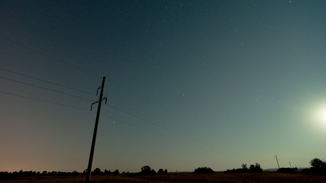 Time lapse of a electricity pylon in front of the milky way