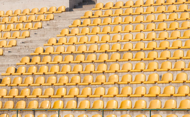 yellow chairs on the soccer field