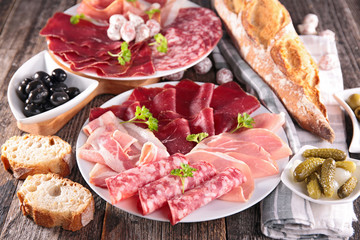 Fototapeta na wymiar table with meat, bread, olive