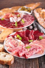 table with meat, bread, olive