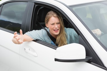 Young woman experiencing road rage