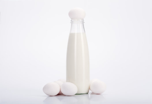 Bottle of fresh cool milk with eggs