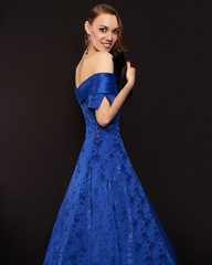Smiling Beautiful lady in blue dress