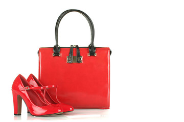 Fashionable red woman bag and shoes isolated on white background