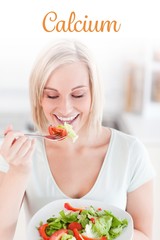 Calcium against blonde woman eating salad