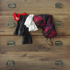 Lingerie hanging on the dresser