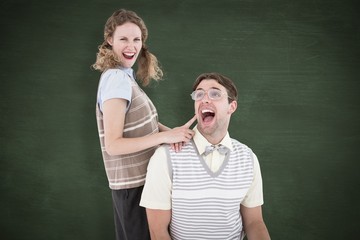 Composite image of excited geeky hipster couple