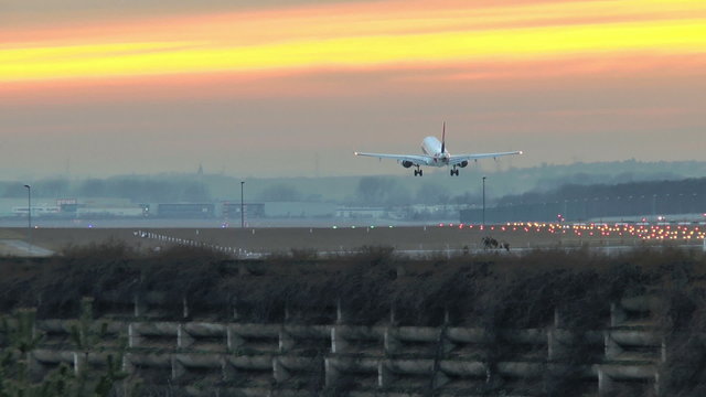 Landing airplane at dusk - Frankfurt Airport