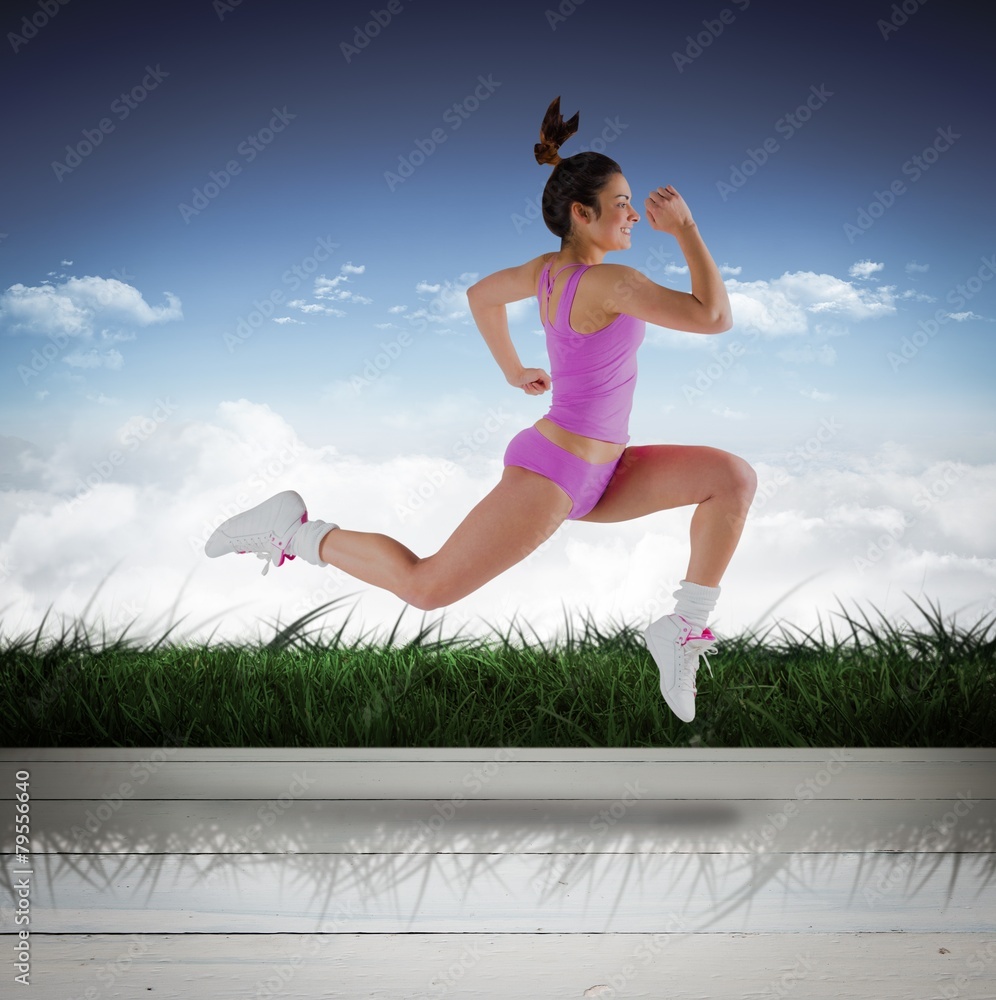 Poster composite image of fit brunette running and jumping