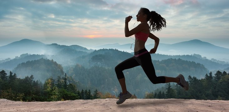 Composite image of full length of healthy woman jogging