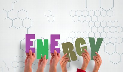 Composite image of hands holding up energy