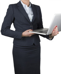 Woman standing with a laptop
