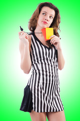 Woman referee with card on white