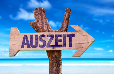 Time Out (in German) wooden sign with beach background