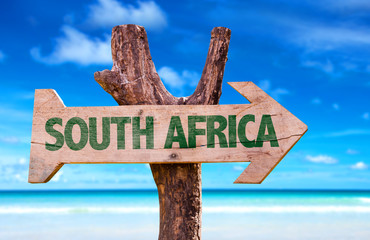 South Africa wooden sign with beach background