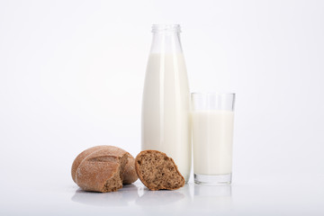 Bottle of fresh milk and crispy bread.