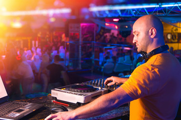 DJ behind the control panel