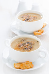 delicious mushroom cream soup with croutons in bowls