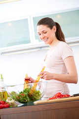 Young woman in the kitchen prepare salad X