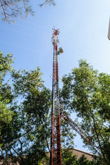 Obraz premium High mast metal structure telecommunication on tower with blue s