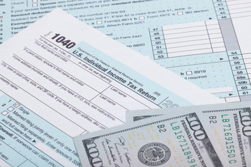 US Tax Form and dollars - studio shot