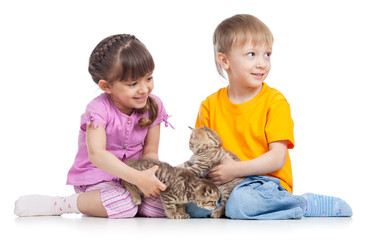 Fototapeta na wymiar two children playing with kitten