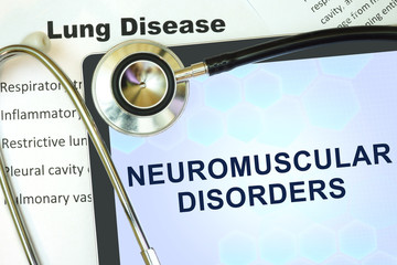 Tablet with words Neuromuscular disorders and stethoscope.