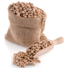 Uncooked chickpeas and wooden scoop