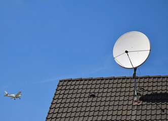 Satellite dish on the roof of a building