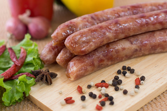 chinese sausages on chopping block
