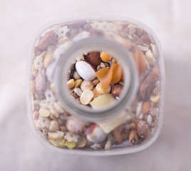 glass bottle with seeds, various cereals inside.