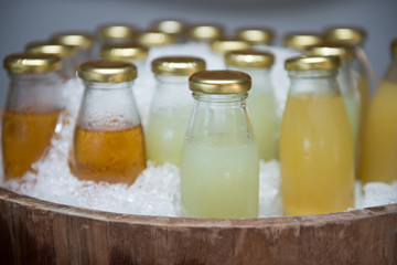 fresh fruit water in glass bottles,