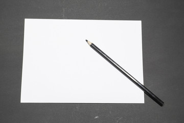 Template blank sheet of paper and black pencil