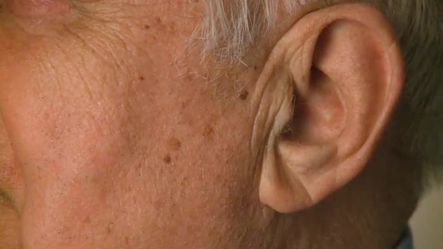 Close up shot of a male in his 70