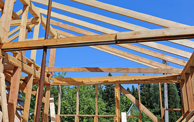 Fototapeta na wymiar Installation of wooden beams at construction
