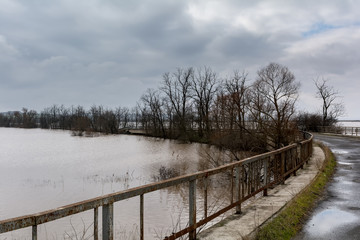 Flood - a natural phenomenon. Spilled lake submerged fields.