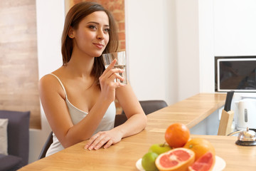 Young Woman with glass of Water. Healthy Lifestyle