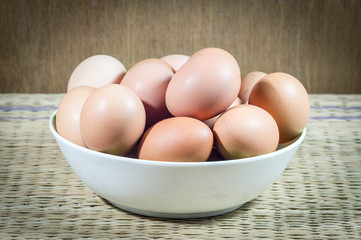 Chicken eggs in a dish.
