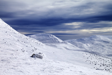 Winter mountains and storm sky