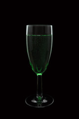 Cocktail in glass on black background isolated. Shampagne.