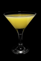 Cocktail in glass on black background isolated.