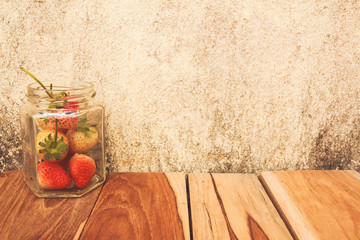 Strawberry jar on a wooden, process color with Vintage Tones. Fo
