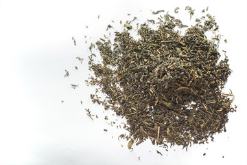 Dried tea leaf on the white background