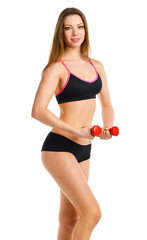 Fototapeta premium Beautiful athletic woman with dumbbells doing sport exercise, is